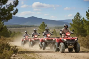 Grupo de amigos en escapadas en Teruel sobre quads guiados por pista forestal de la Sierra de Gúdar-Javalambre.